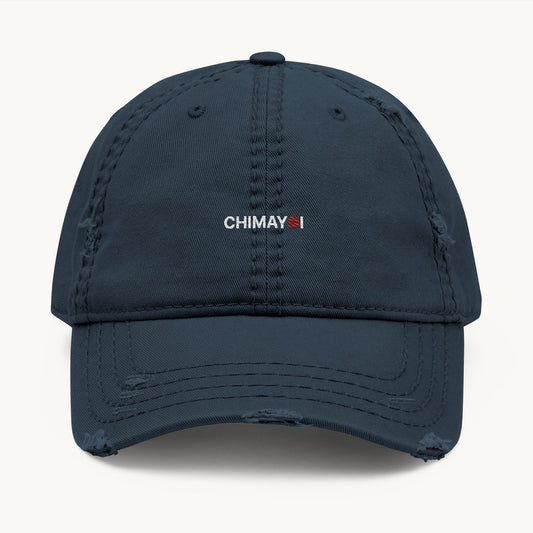 A dark navy blue distressed baseball cap with 'CHIMAYI' embroidered on the front, detailing vintage frayed brim and minimalist logo.