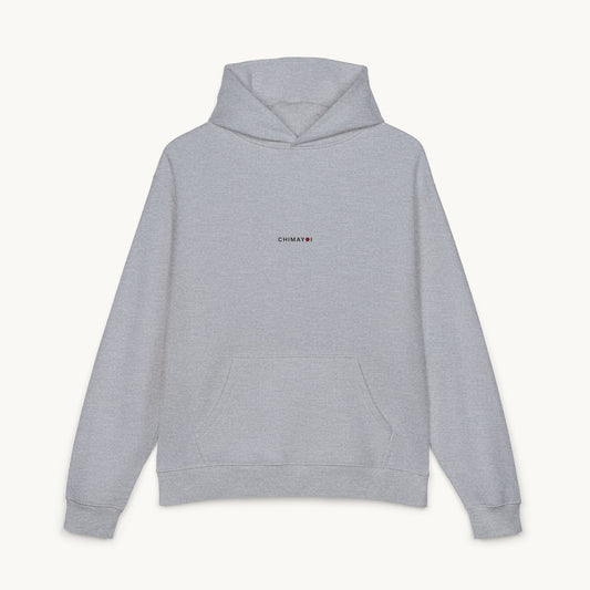 Front view of light grey minimalist hoodie featuring small centered CHIMAYOI embroidered logo